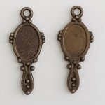 Bronze hand mirror charm.