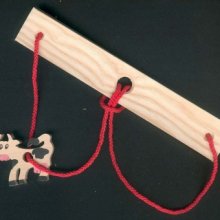 The cow, headache wood and string handcrafted