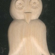 Carved owl waxed nature