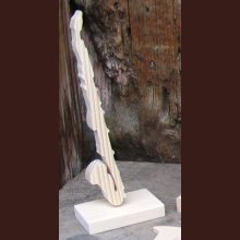 bass clarinet mounted on a base, wooden cut-out, musical decoration for party table