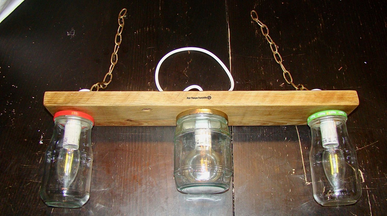 Small chandelier with recycled jars and wood.