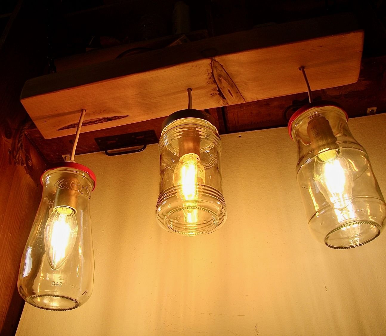 Small chandelier with recycled jars and wood.