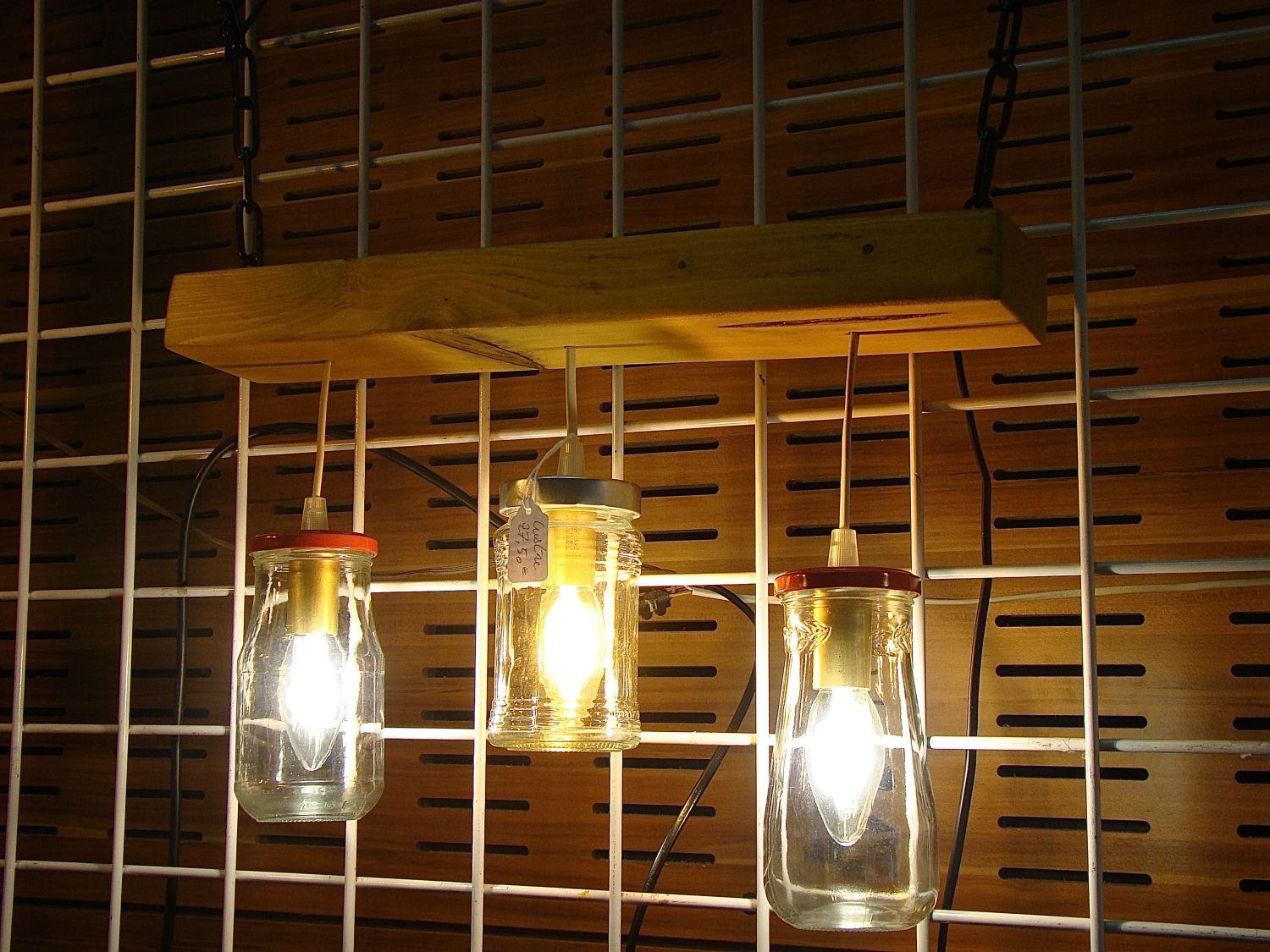 Small chandelier with recycled jars and wood.