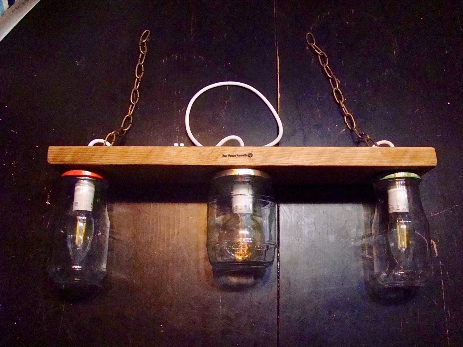 Small chandelier with recycled jars and wood.