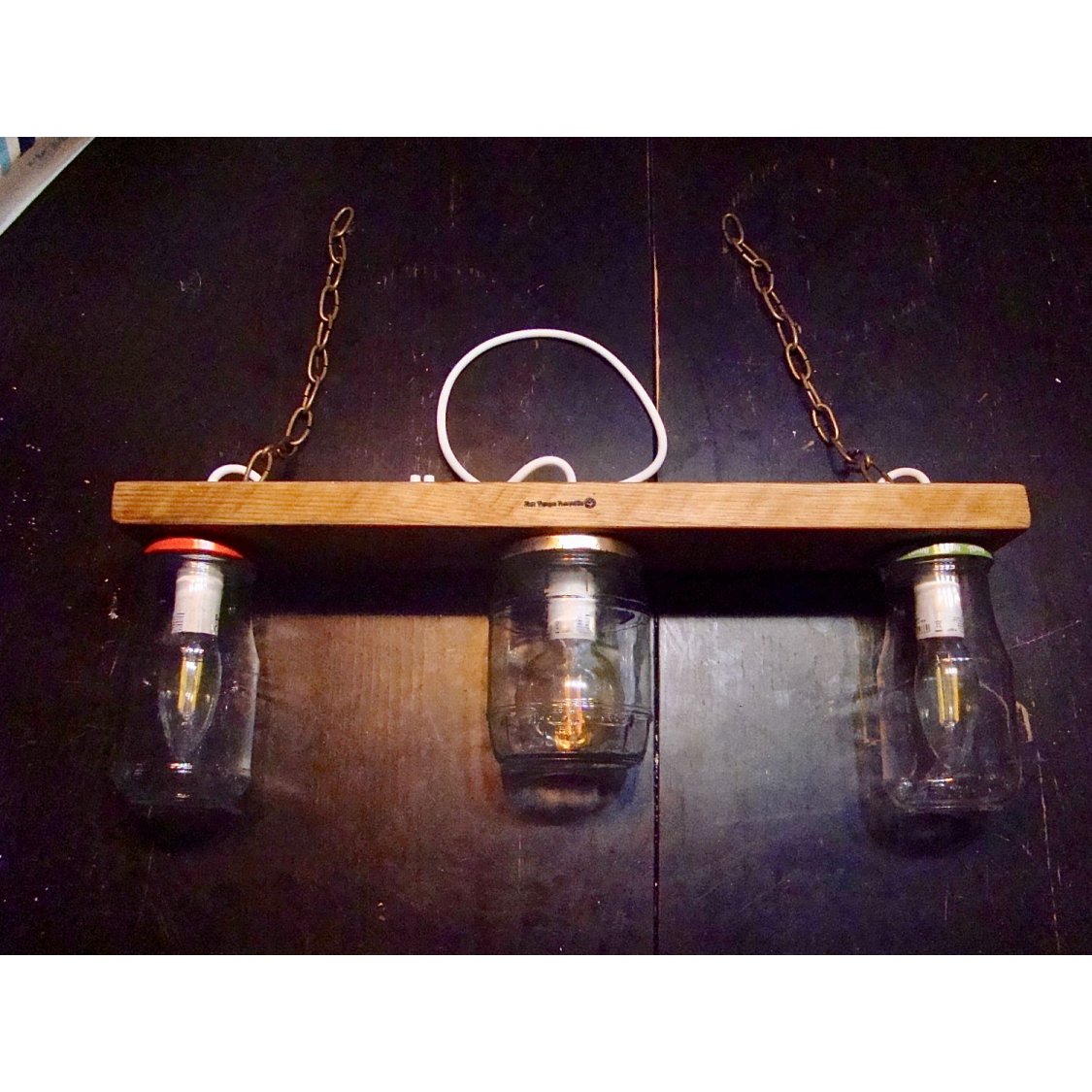 Small chandelier with recycled jars and wood.