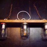 Small chandelier with recycled jars and wood.