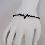 Thin black bracelet design Waves