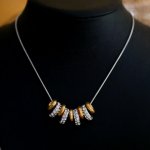 Necklace with silver and gold rings