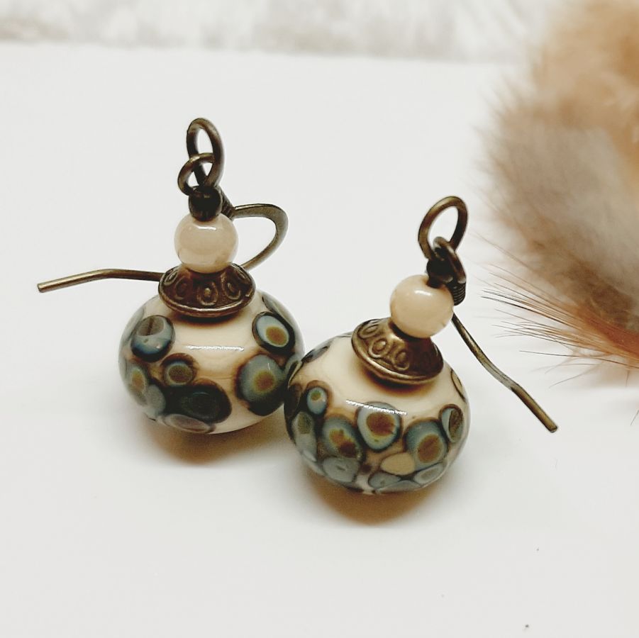 original fancy earrings with a handmade beige and bronze rakue effect glass bead