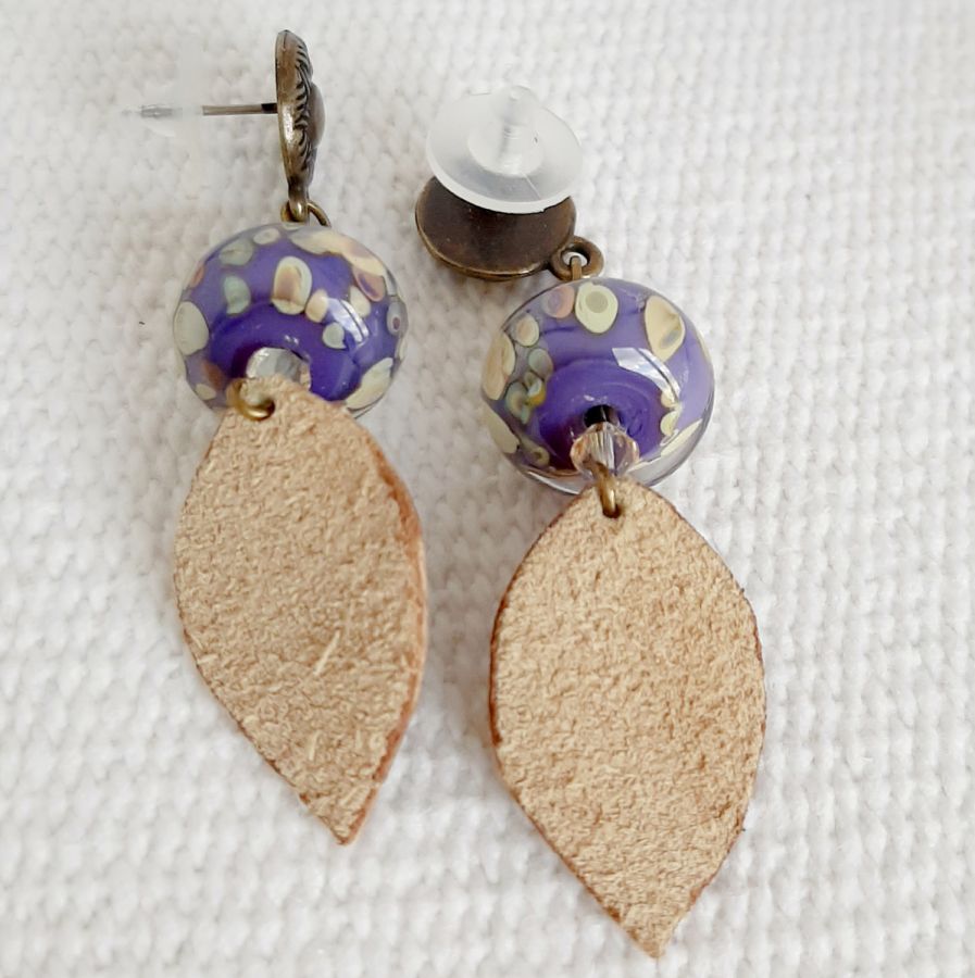 designer dangling earrings with handmade glass bead and handmade leather leaf