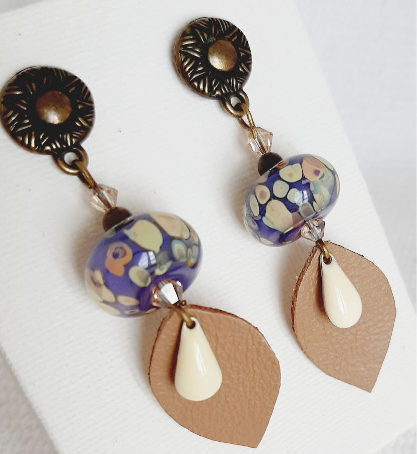 designer dangling earrings with handmade glass bead and handmade leather leaf