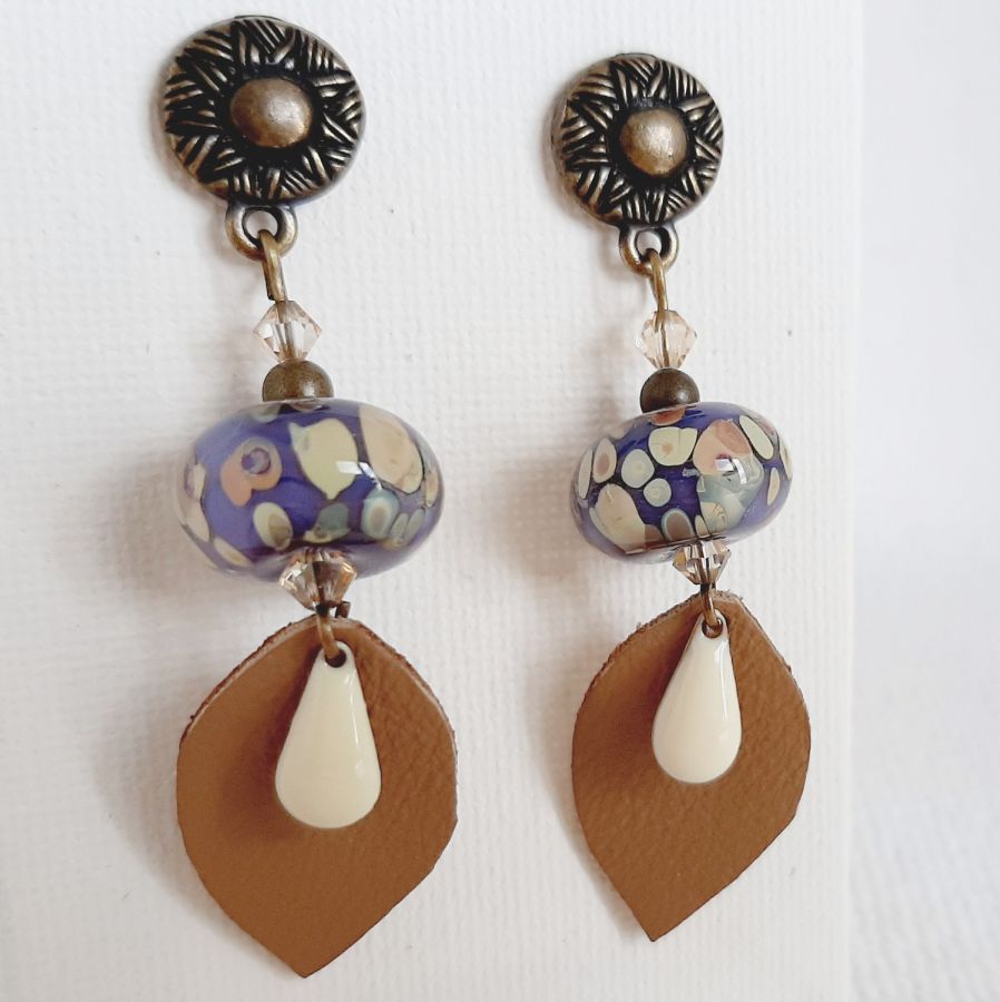 designer dangling earrings with handmade glass bead and handmade leather leaf