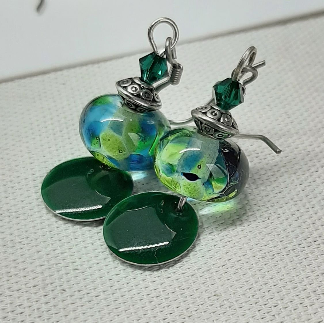 dark green earrings for pierced ears with handmade spun glass pendant