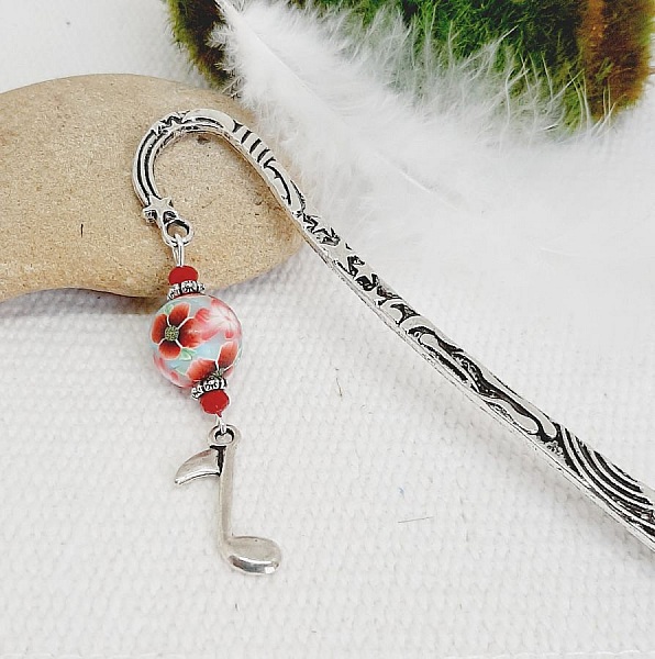 bookmark with silver music note theme and beautiful handmade peel with poppy design