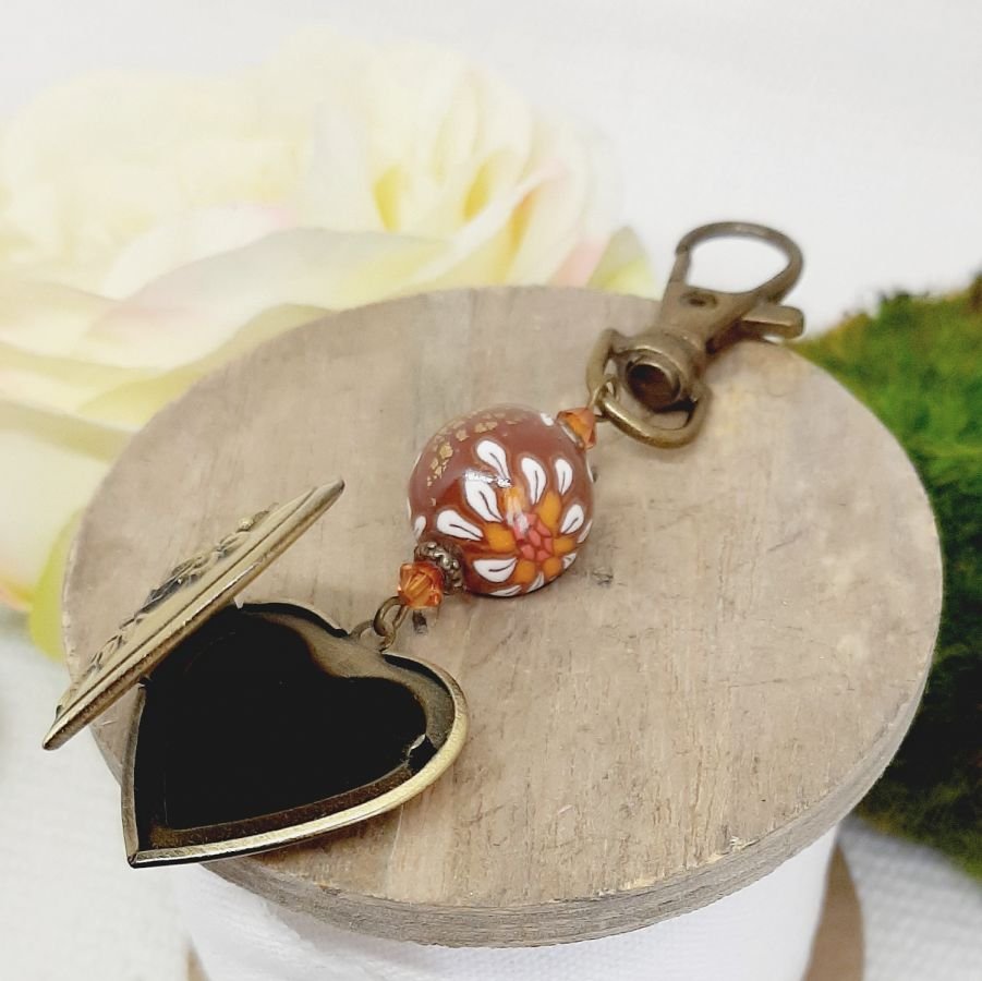 pedentific keychain photo holder and bead in brown polymer clay and white floweraet 