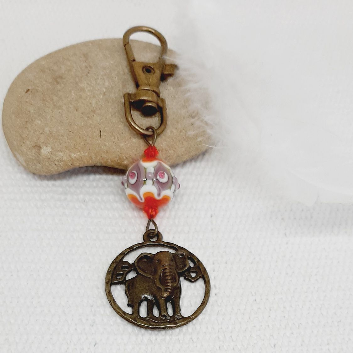 keychain pendant elephant bronze color and beautiful handmade glass bead spun