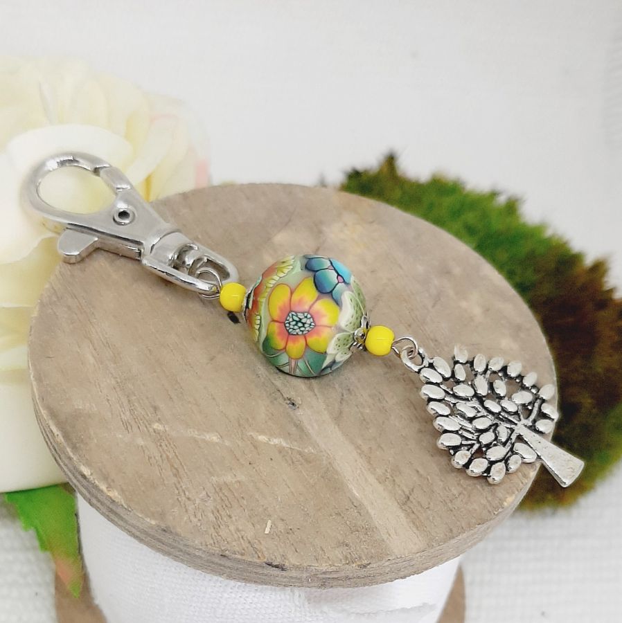 silver keychain with tree of life symbol and multicolored handmade pearl