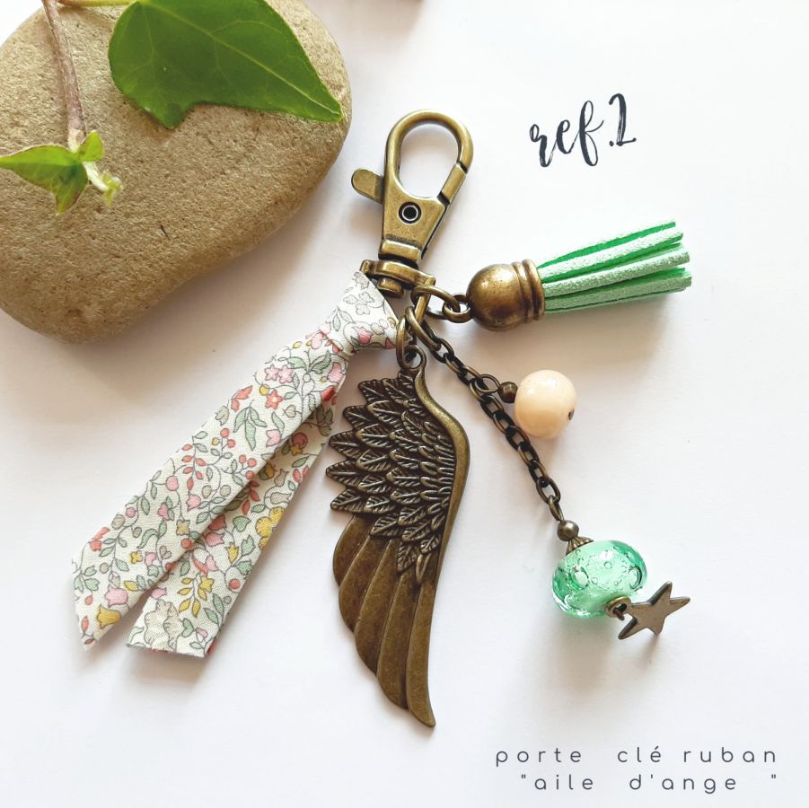 Keychain or purse jewel with angel wing pendant in soft pastel colors