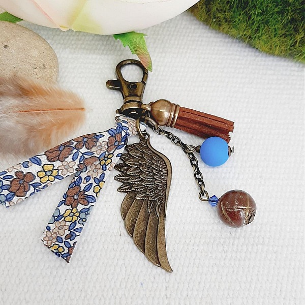 Keychain or bag jewel with angel wing pendant bronze color brown and blue 