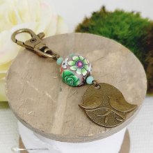 key ring medal duo of birds bronze color and pearl crafted floral pattern green and wine leesmulticolor