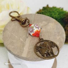 keychain pendant elephant bronze color and beautiful handmade glass bead spun