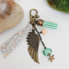 Keychain or purse jewel with angel wing pendant in soft pastel colors