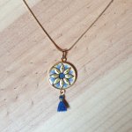 Gold/blue flower pendant necklace on gold chain