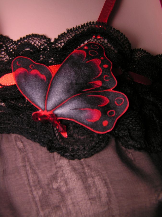 red and black silk butterfly garter on black Rachel lace