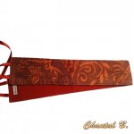 Wide belt in wild silk with orange arabesques on a brown background to tie