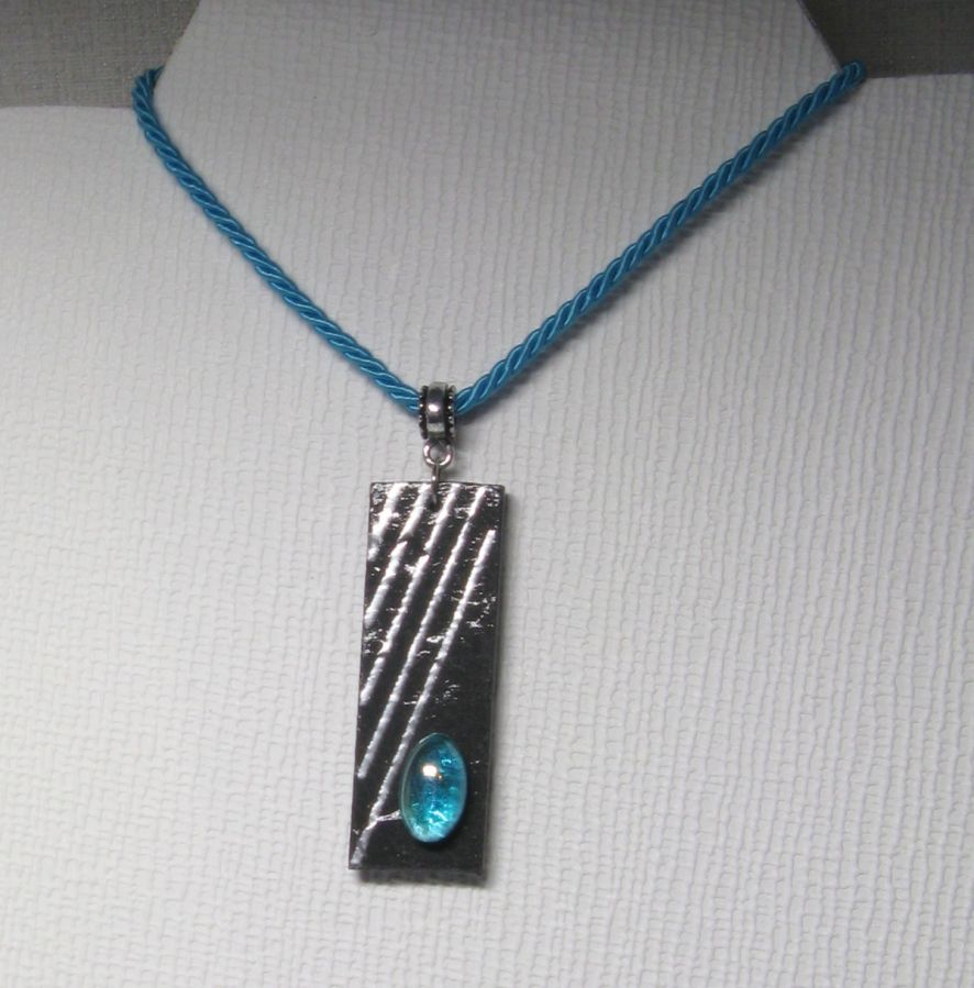 Pendant woman in slate and blue glass cabochon on blue cotton cord handmade