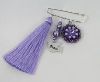 Purple brooch with assorted jewels