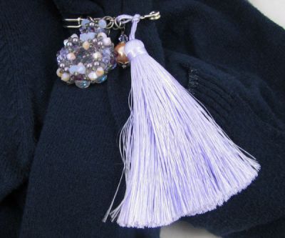 pearl brooch with purple pompon