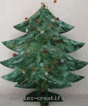 wooden fir tree decorated with beads