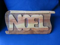 Wooden sculpture of the word NOEL