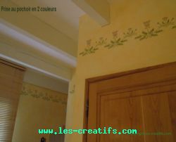 Stencilled frieze on bathroom walls