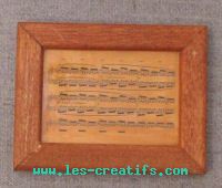 Small wooden frame with music score