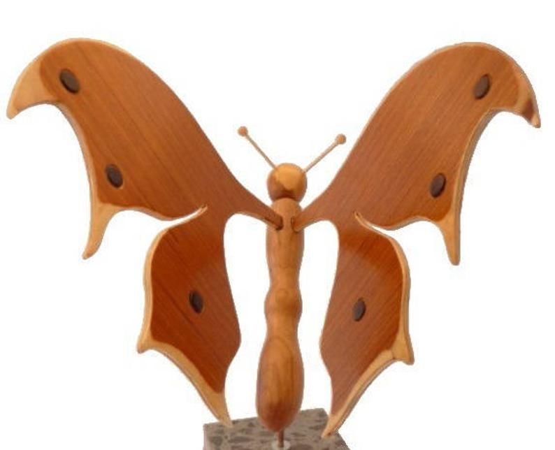 butterfly in sapiens, cherry and beech small touch of ebony on a base in Italian marble Terrazzo to be posed wood sculpture