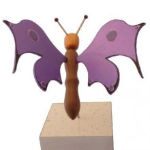 Electric purple butterfly on a stand wood sculpture