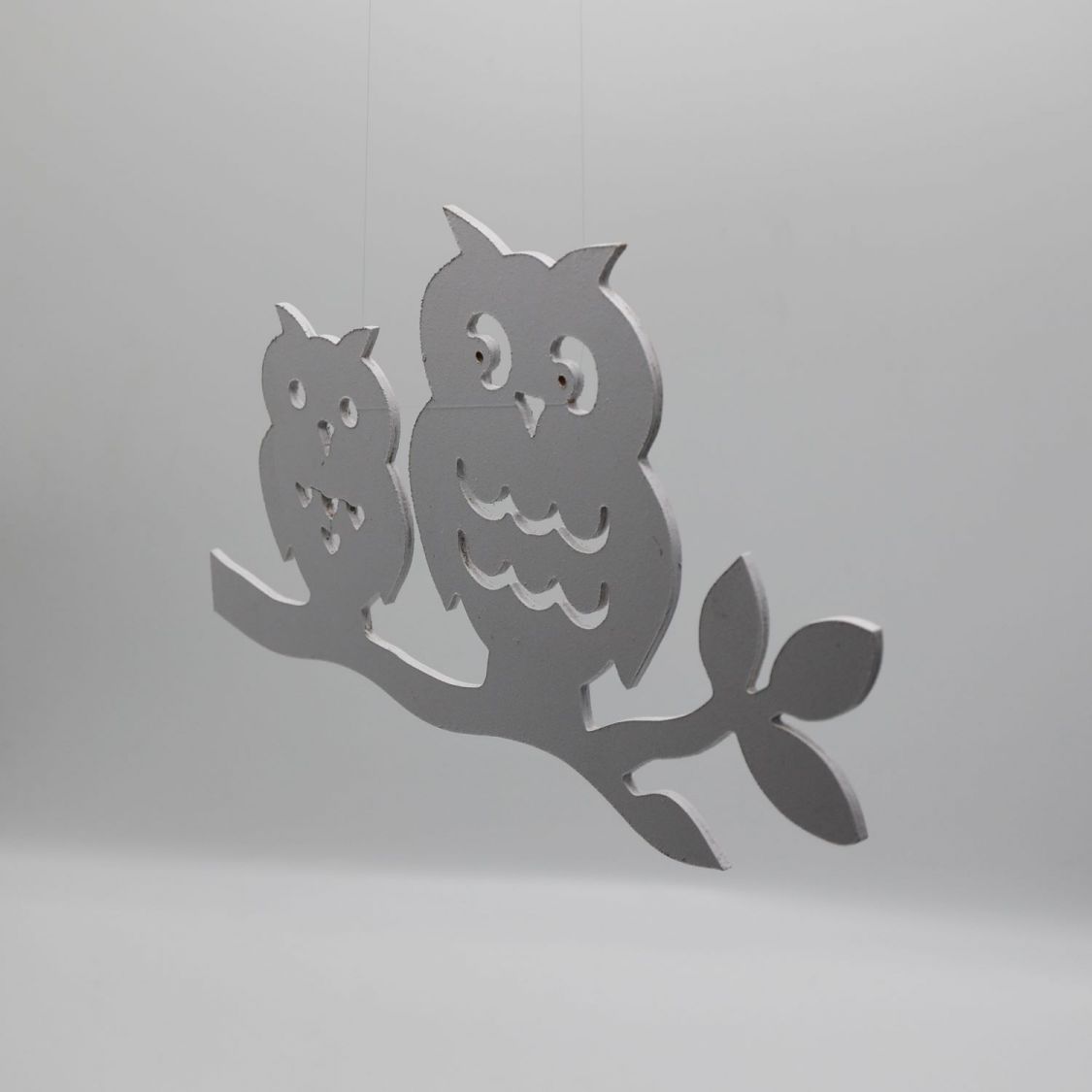  2 owls perched on a branch