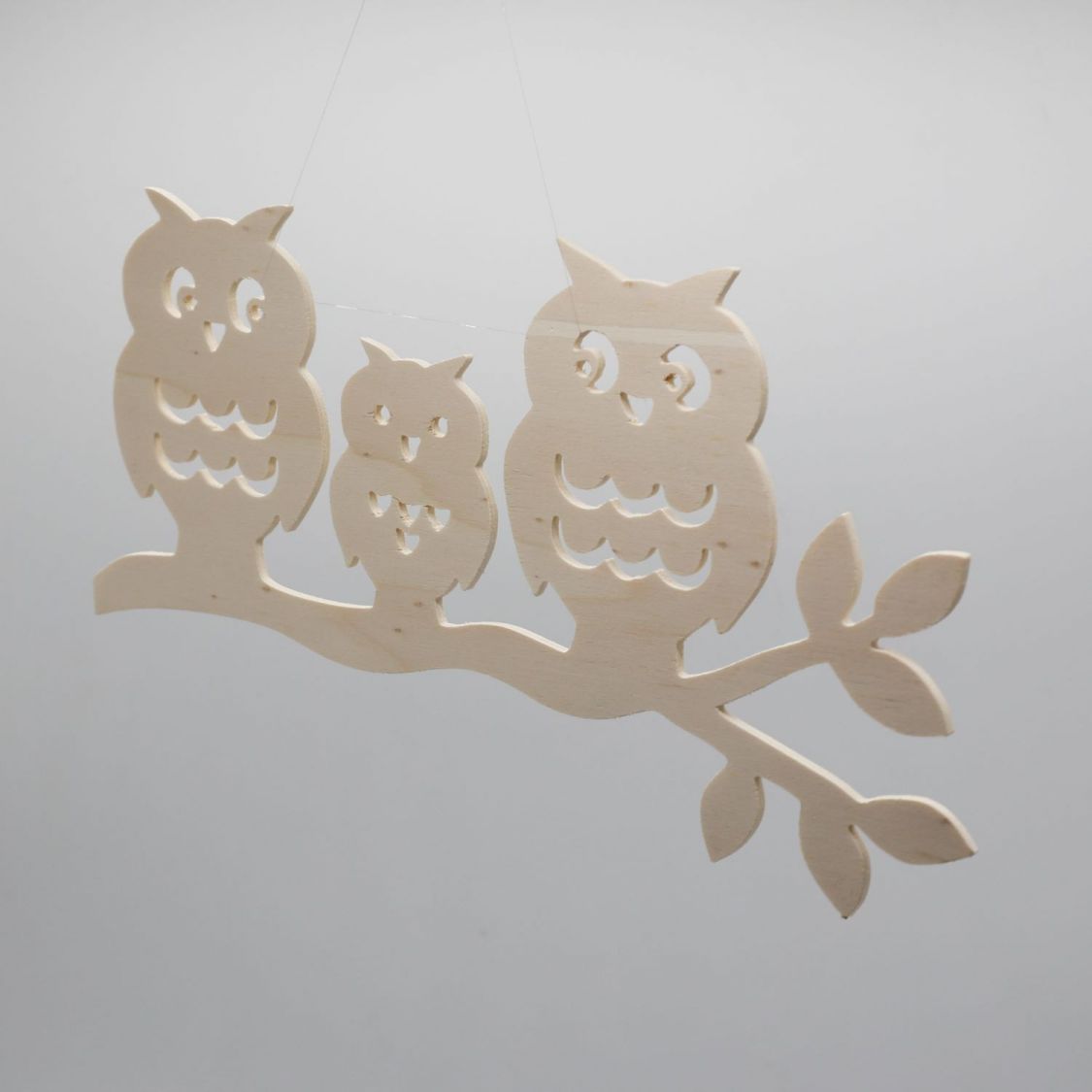  3 owls perched on a branch