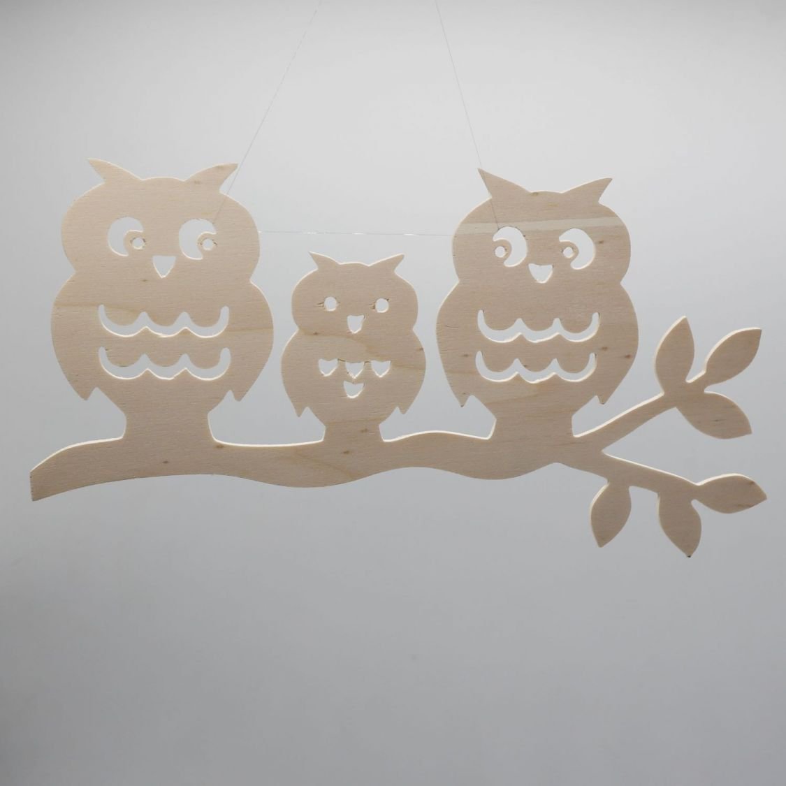  3 owls perched on a branch