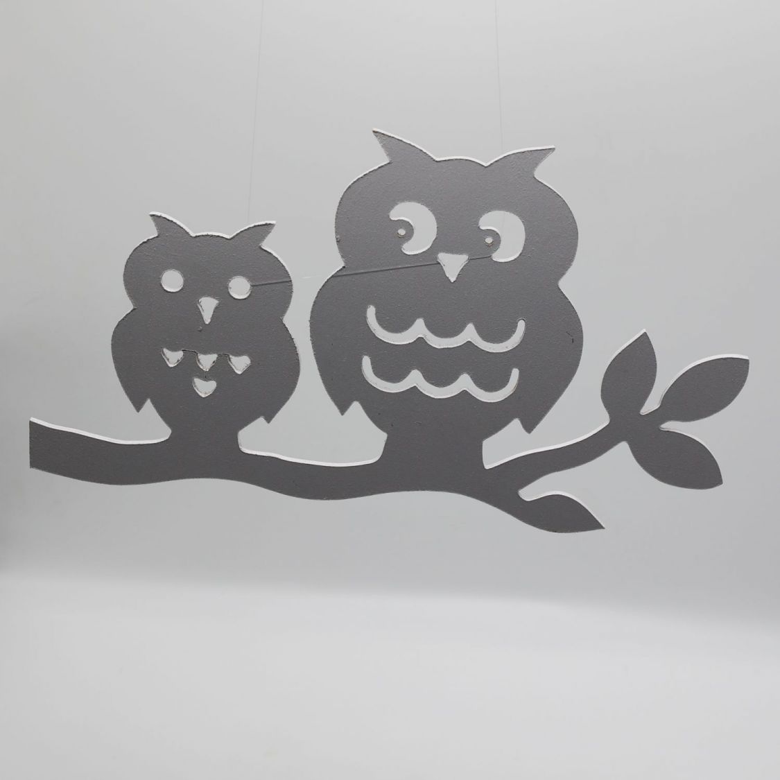  2 owls perched on a branch