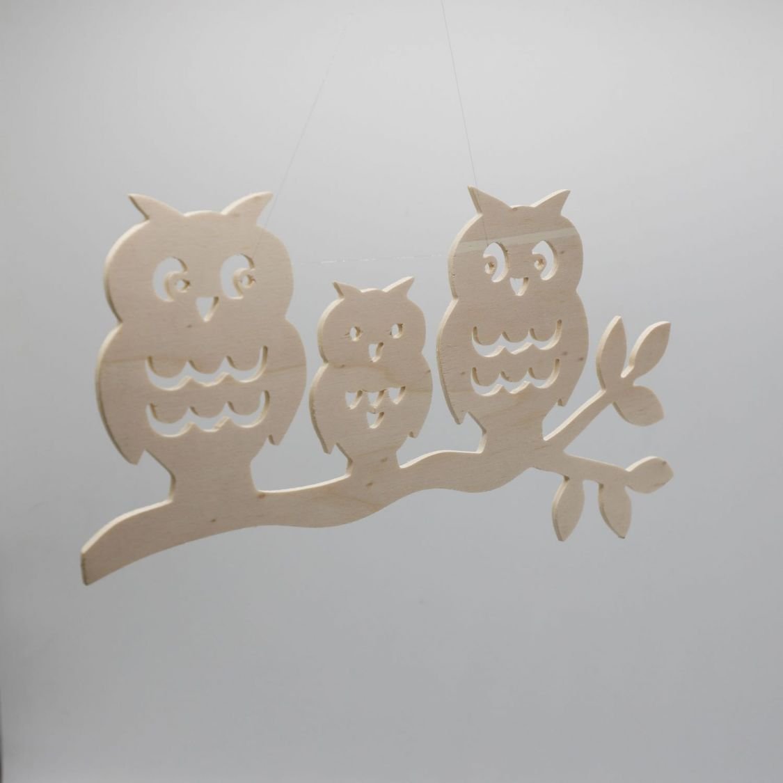  3 owls perched on a branch