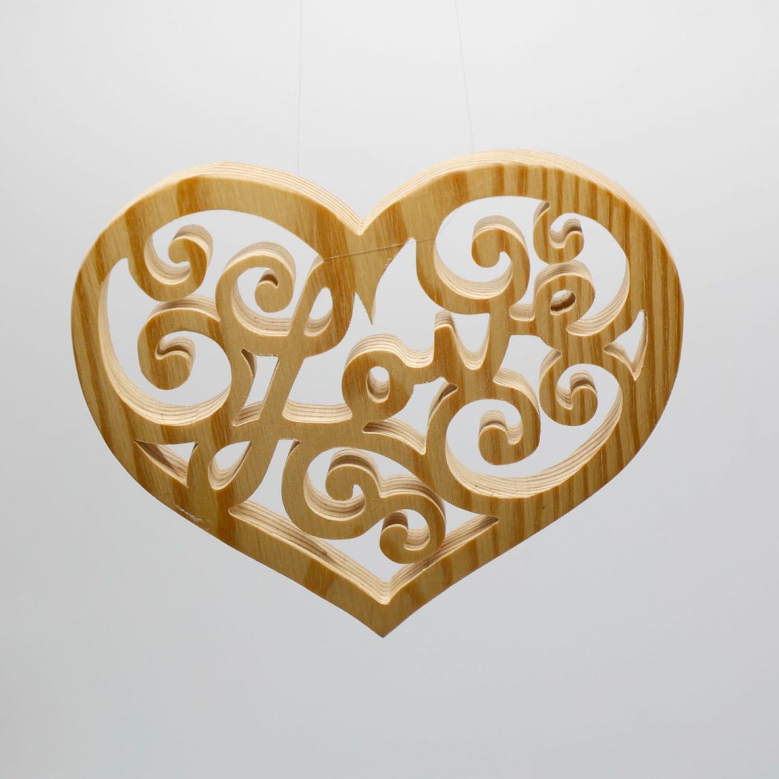 Openwork heart with the word LOVE cut out