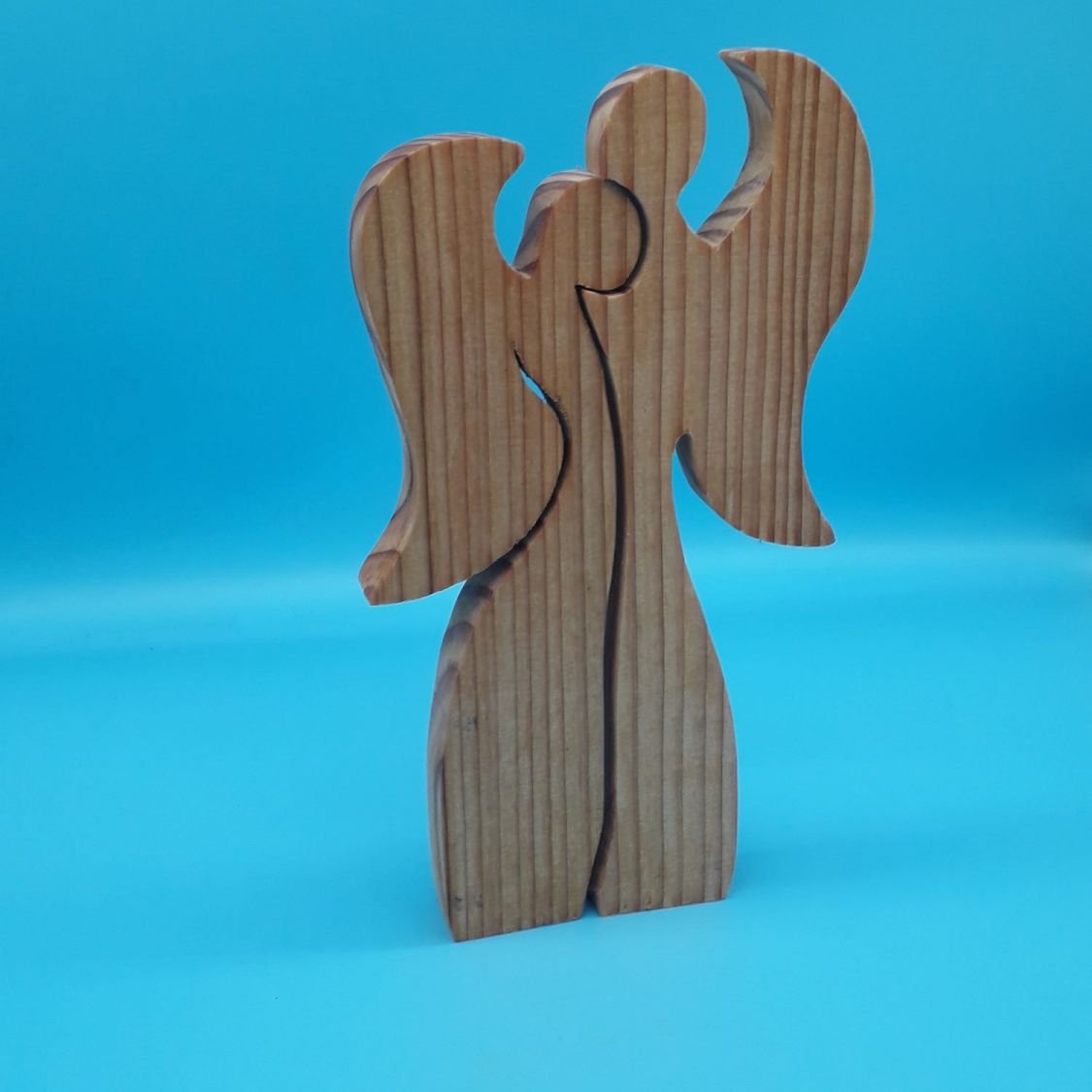 Couple of 2 angels embracing