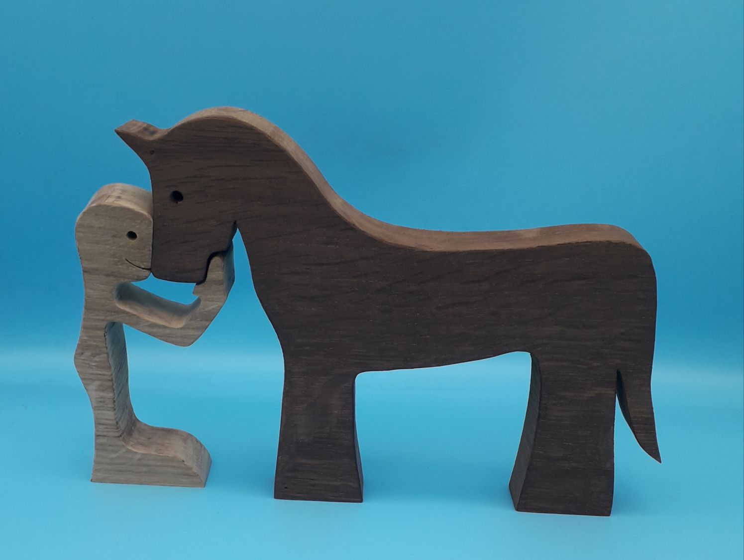 Figurine Man and his horse in wood
