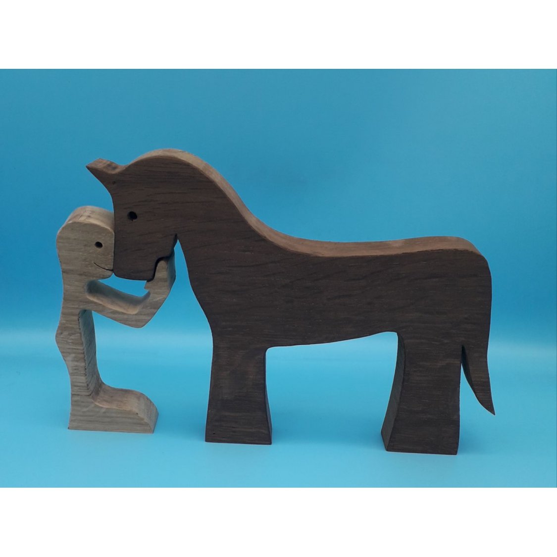 Figurine Man and his horse in wood