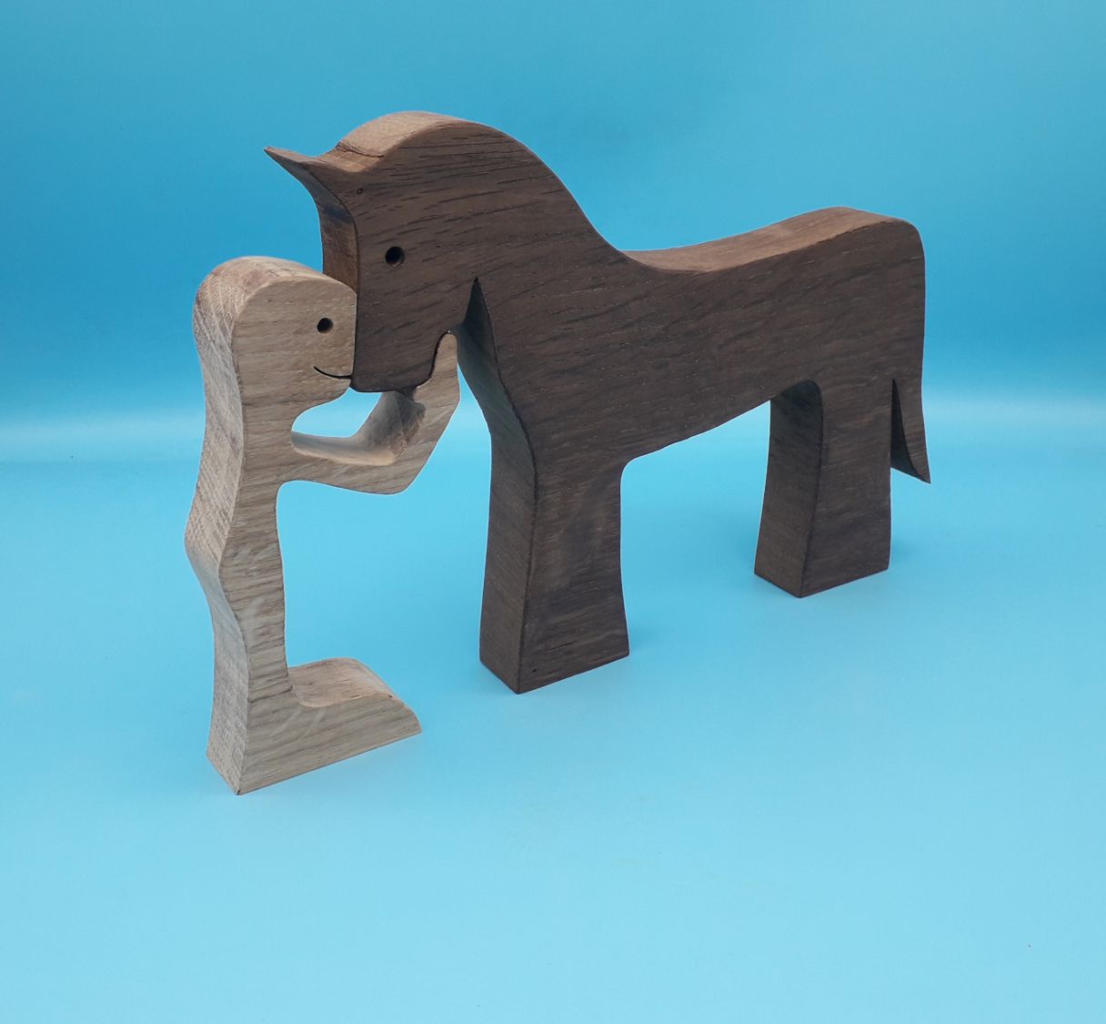 Figurine Man and his horse in wood