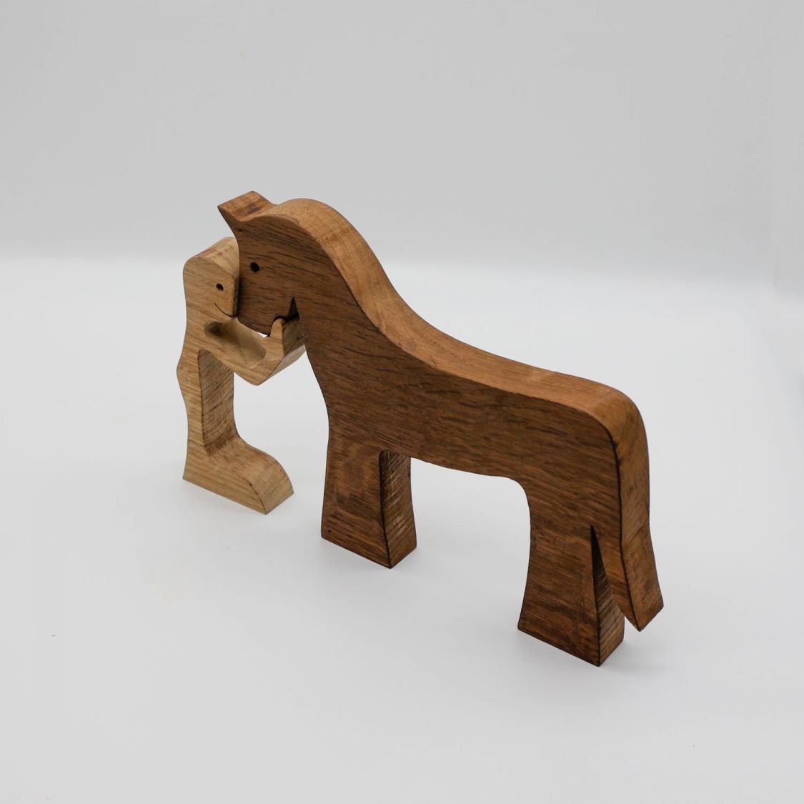 Figurine Man and his horse in wood