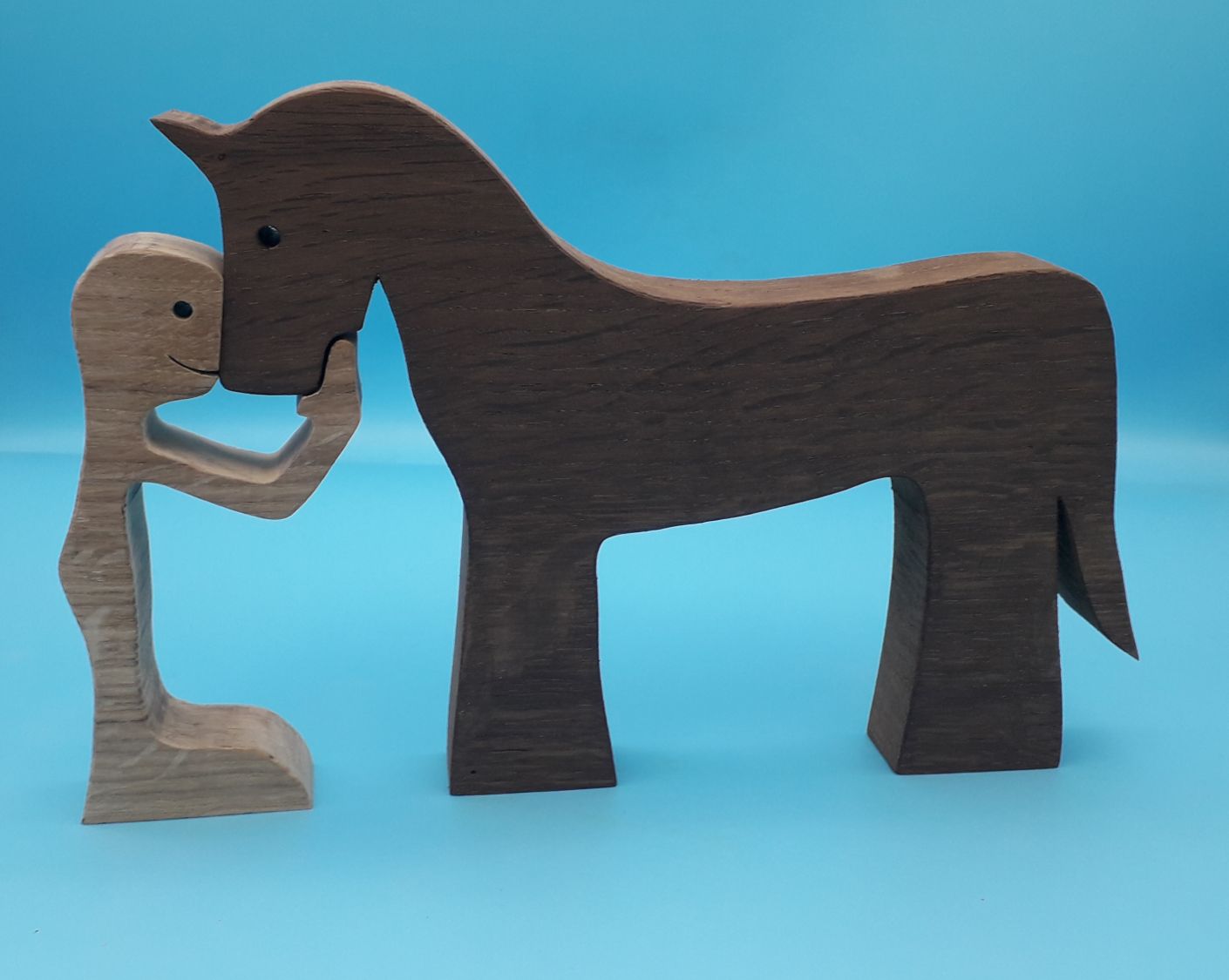 Figurine Man and his horse in wood